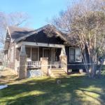 The 1920s Bozeman House after removal of asbestos shingle siding. The original wood clapboard siding is in good condition and will be saved.